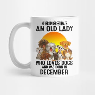 Never Underestimate An Old December Lady Who Loves Dogs Mug